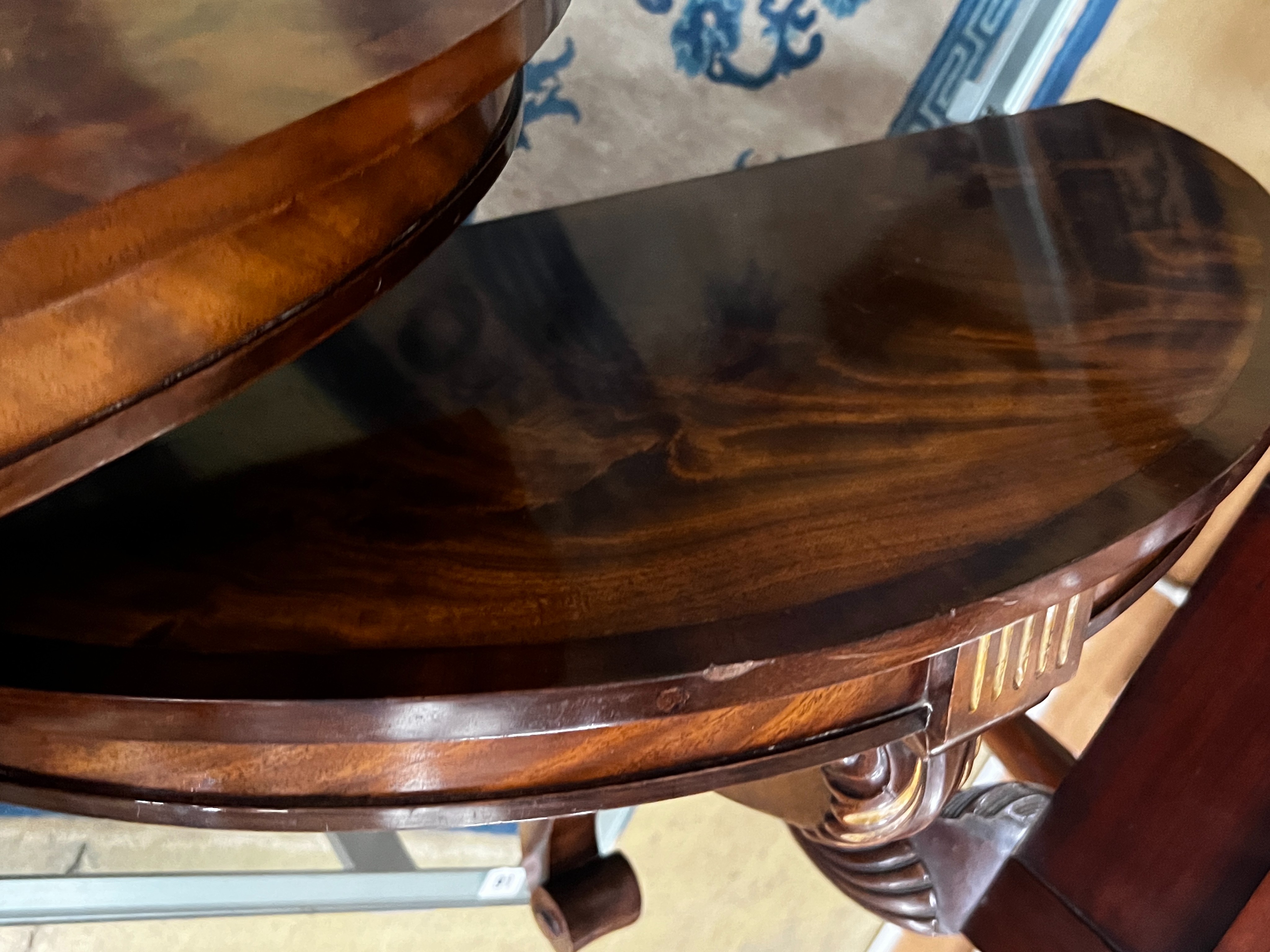A pair of reproduction parcel gilt demi lune console tables, width 82cm, depth 34cm, height 48cm